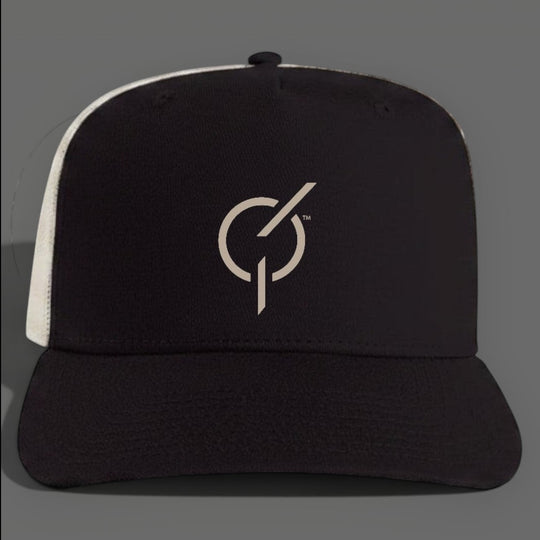 area 609 The Core Trucker Hat in black cotton with an ecru mesh back, featuring a flat peak and snapback closure.